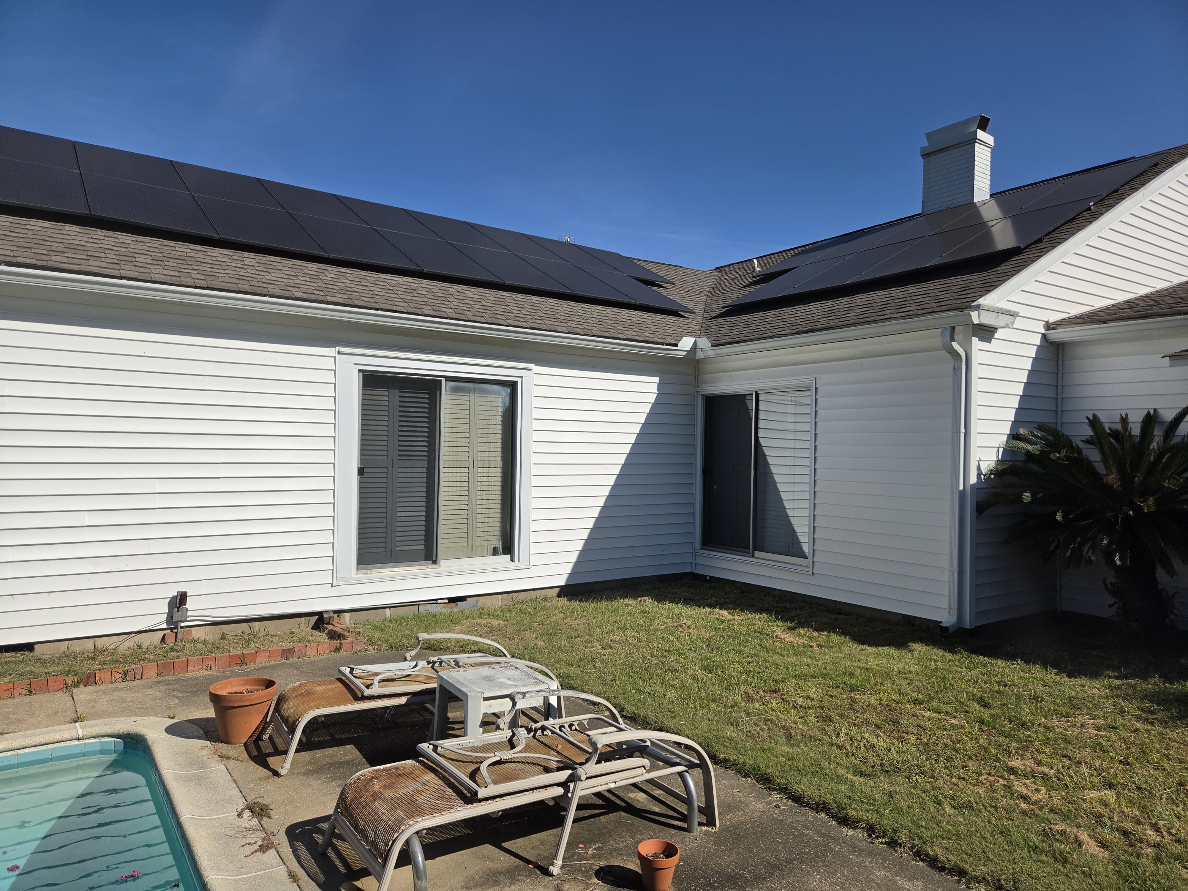 Exterior view from the Chuck deck project beside a home and pool